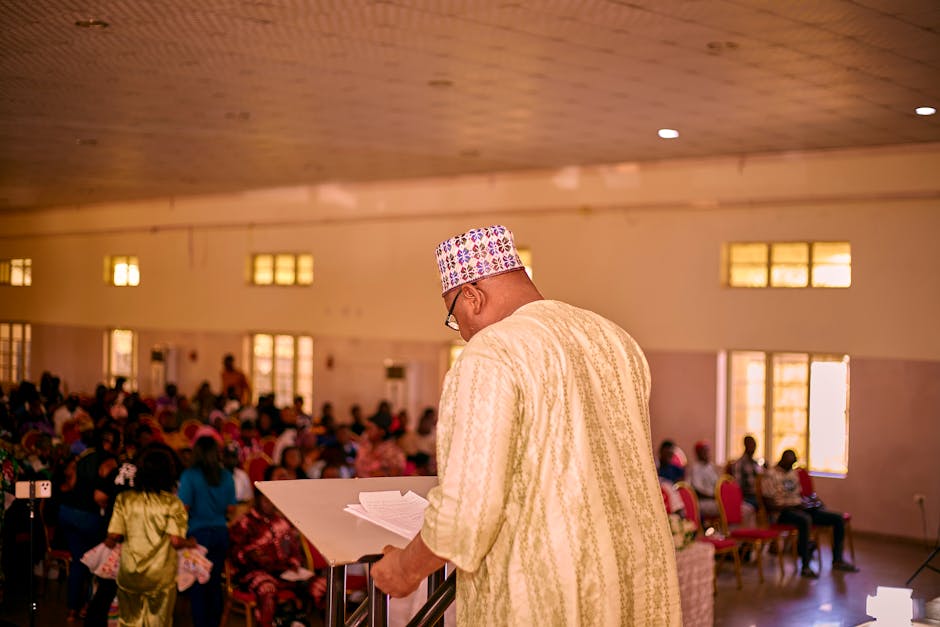 A diverse group of people collaborating and learning in a bright, modern space.